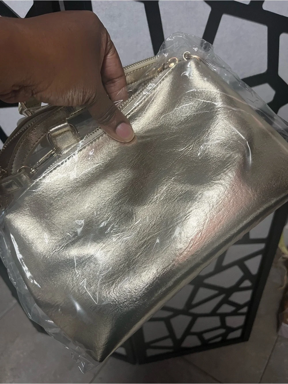 Gold clear two and one purse with handles and gold straps.